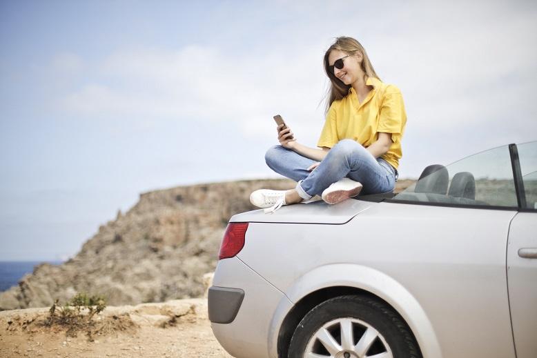 image of woman on car