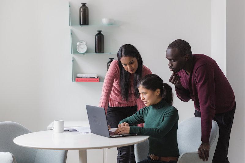 three people working