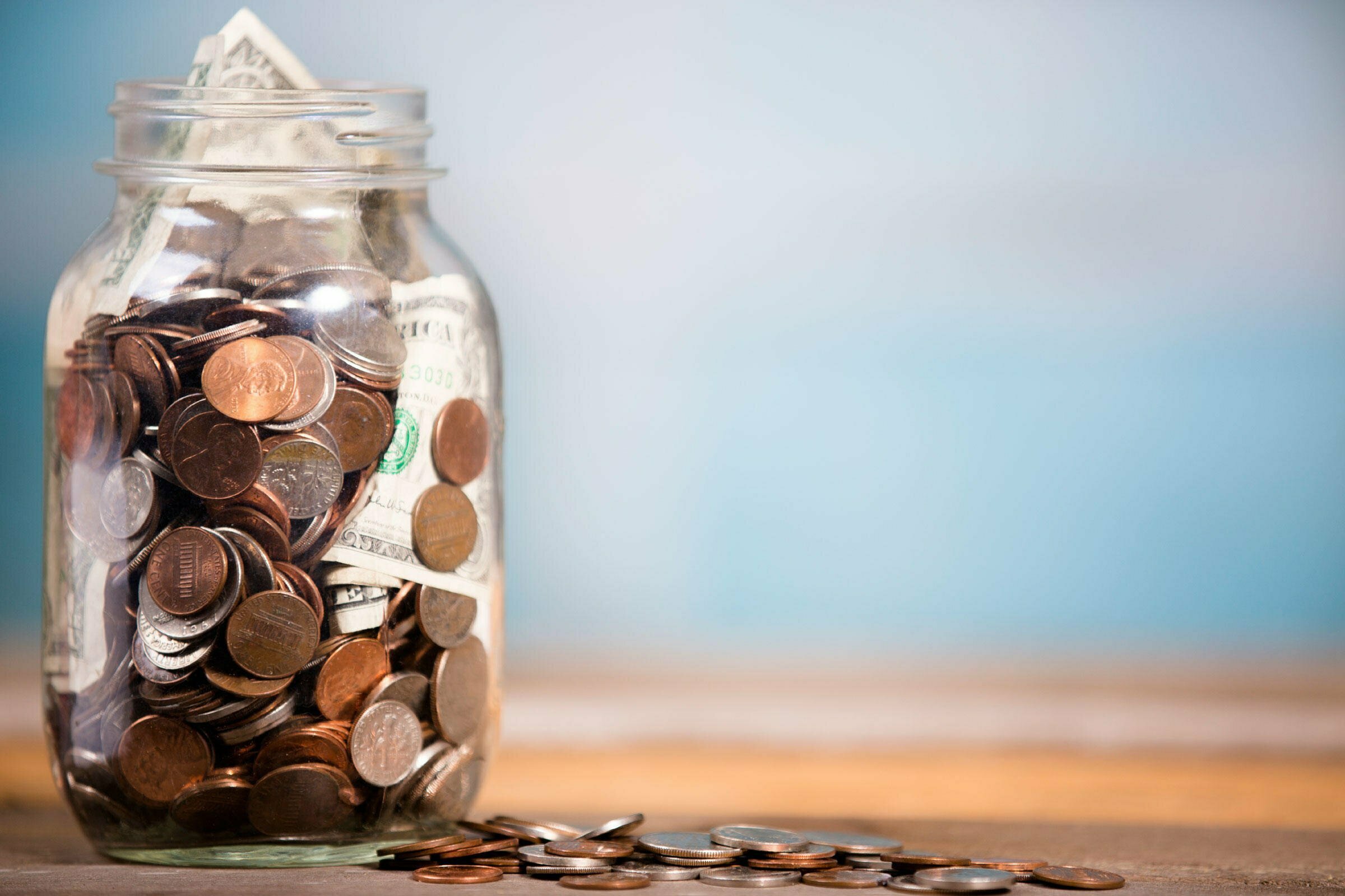 Freelancer's guide to taxes money in a Mason jar