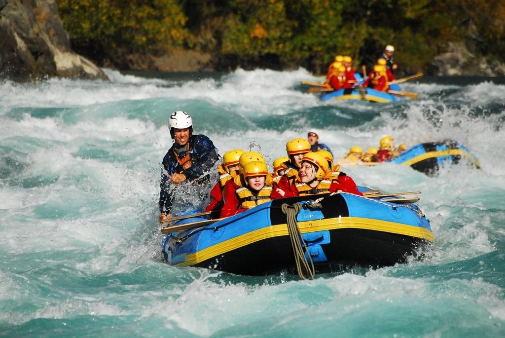 travel marketing image of a group enjoying a white water rafting trip