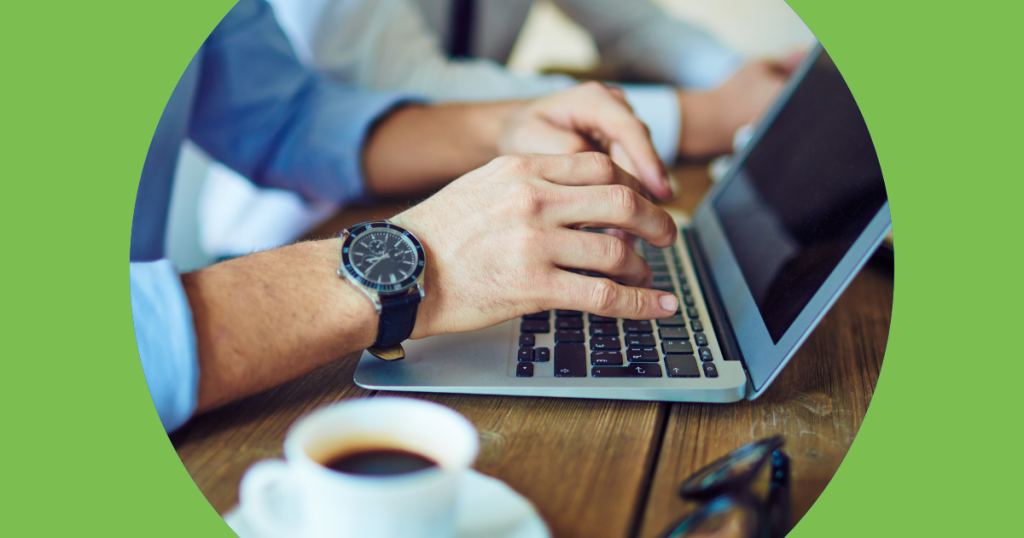 Person typing on a laptop.