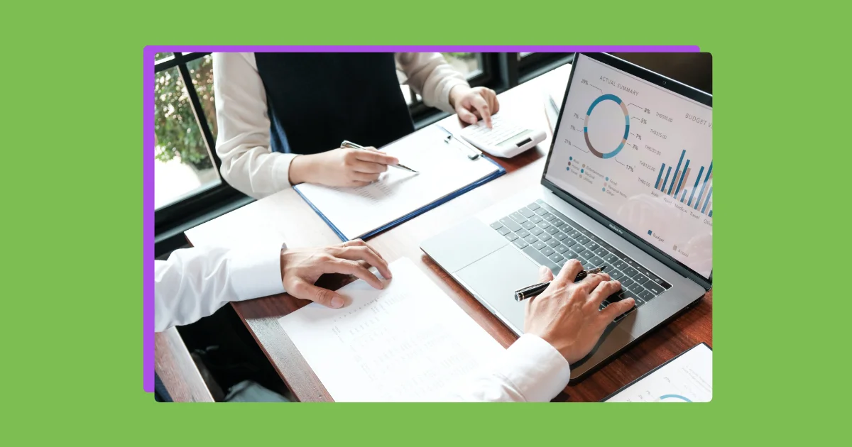 people working at a desk with a green background.